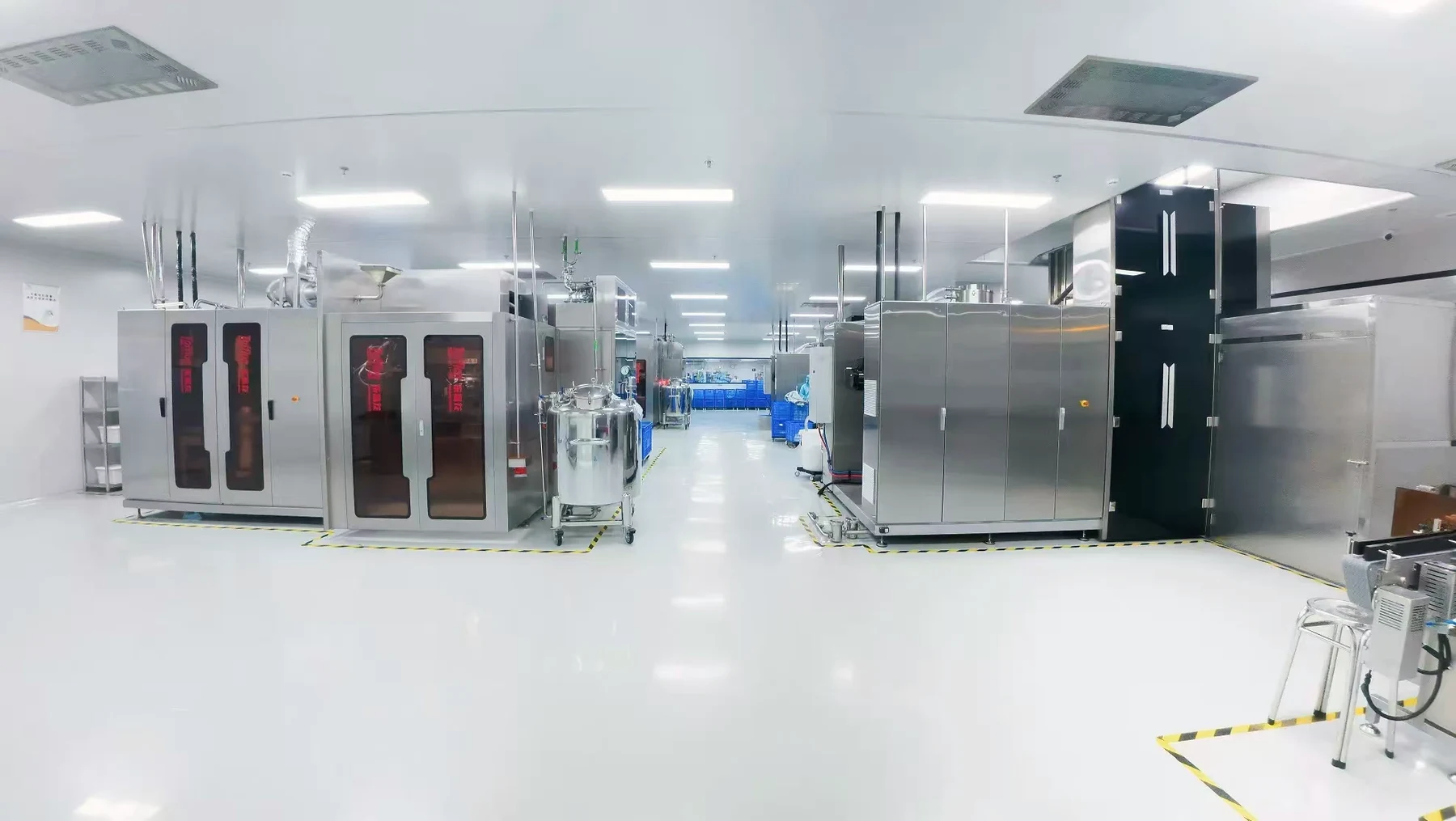 Production hall with equipment and marked aisles